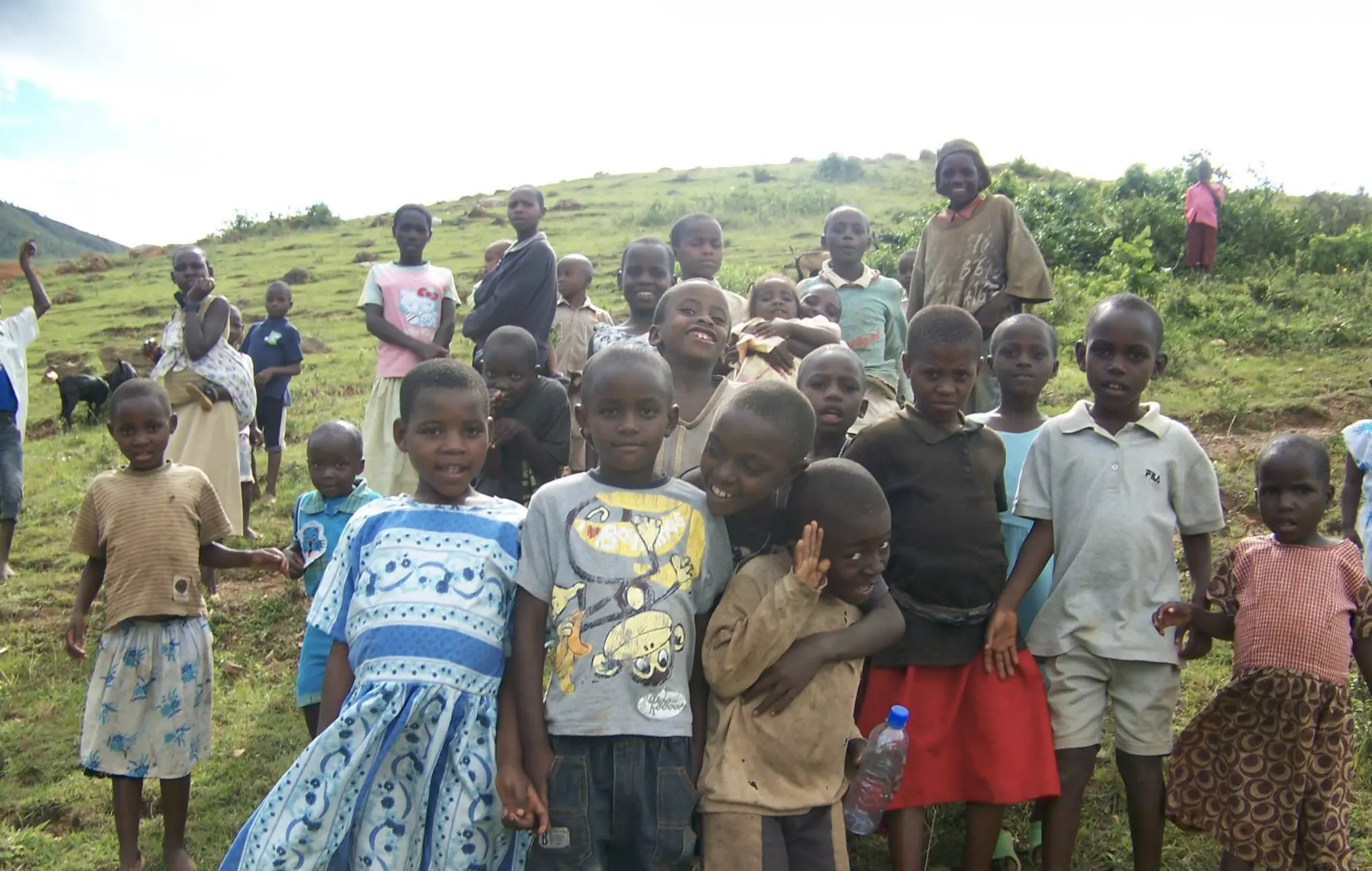 A community of children gathered outdoors