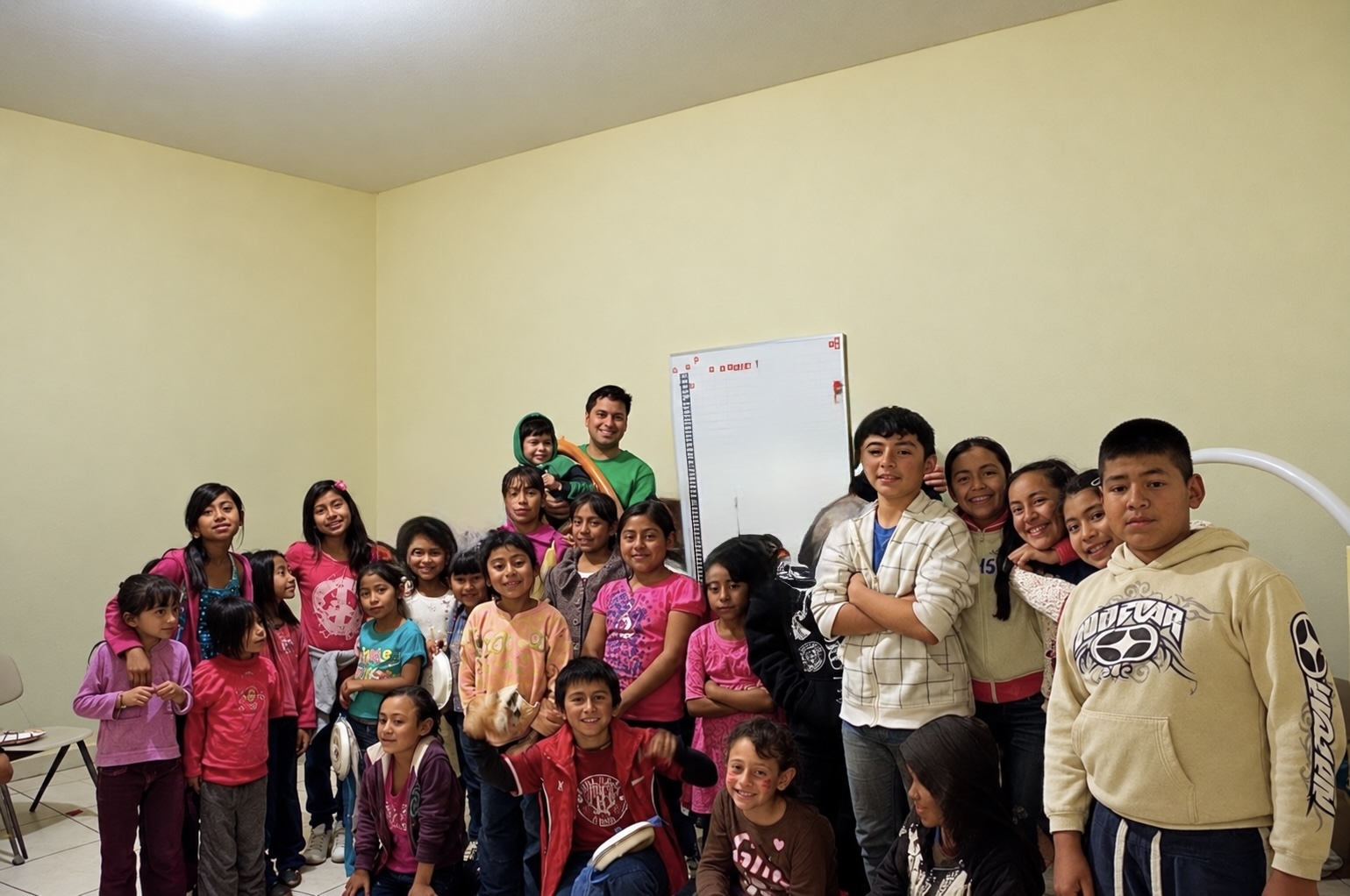 Families and children gathered together in a community room